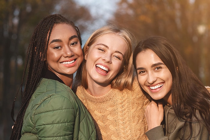 Teens smiling at Highlands Ranch Orthodontics in Littleton, CO